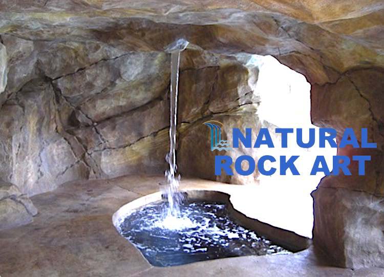 Rock-cave/grotto with waterfall and small pool using simulated rock.